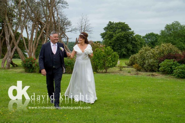 bride and groom strolling at Kilronan Castle