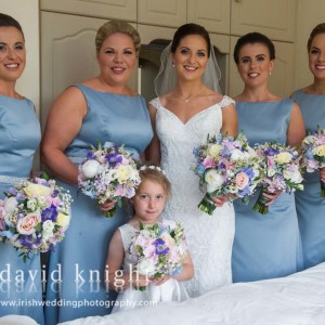 Bride, bridesmaids and flower-girl